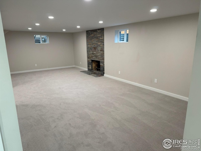 1225 Ithaca Dr, Boulder, CO 80305 - basement featuring recessed lighting, carpet floors, a fireplace, and baseboards