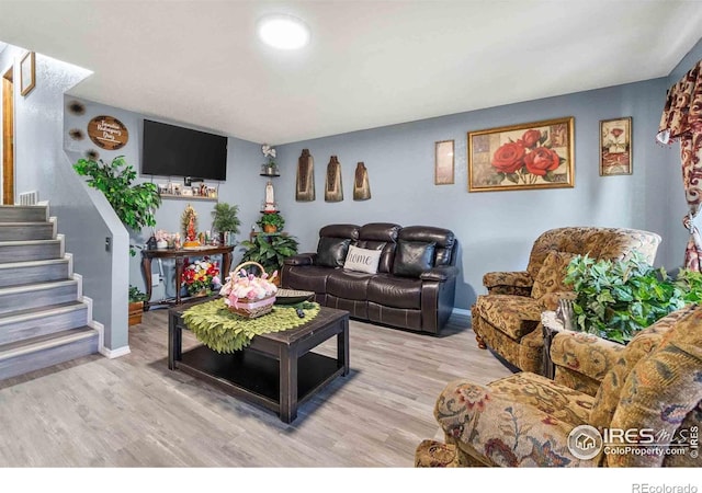 316 43rd Avenue Ct, Greeley, CO 80634 - living area featuring light wood-type flooring, stairs, and baseboards