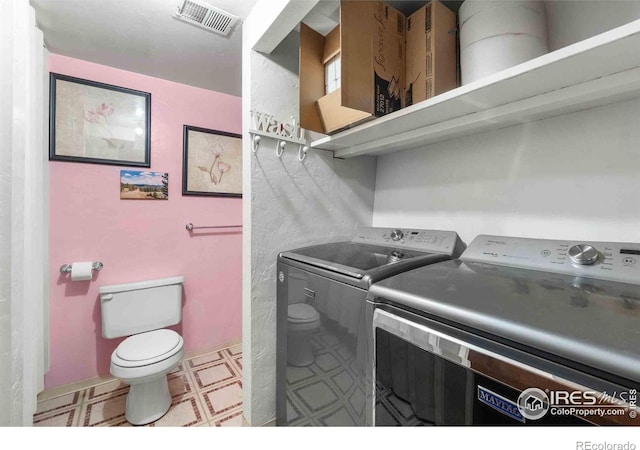316 43rd Avenue Ct, Greeley, CO 80634 - clothes washing area with washer and clothes dryer and tile patterned floors
