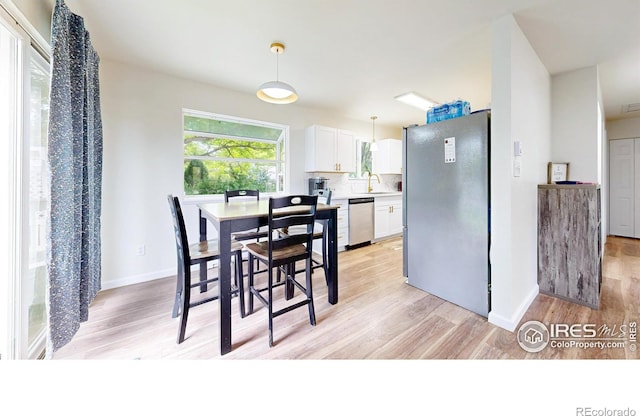 2648 Bradbury Ct, Fort Collins, CO 80521 - dining space with light wood-type flooring and baseboards