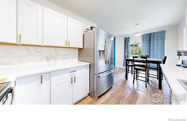 2648 Bradbury Ct, Fort Collins, CO 80521 - kitchen featuring stainless steel fridge with ice dispenser, light wood-style flooring, decorative backsplash, white cabinetry, and light countertops