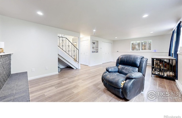 2648 Bradbury Ct, Fort Collins, CO 80521 - living room with stairway, light wood-type flooring, baseboards, and recessed lighting