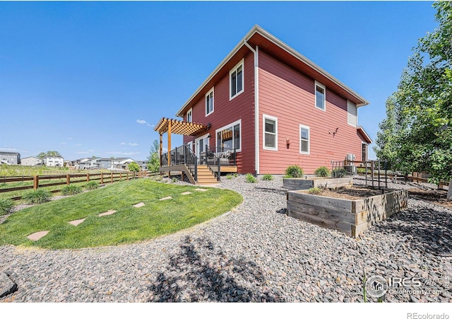 6009 Autumn Breeze Ct, Fort Collins, CO 80528 - view of property exterior with a vegetable garden, a deck, stairway, and a pergola