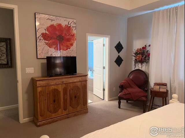 8241 White Owl Ct, Windsor, CO 80550 - bedroom with light colored carpet and connected bathroom