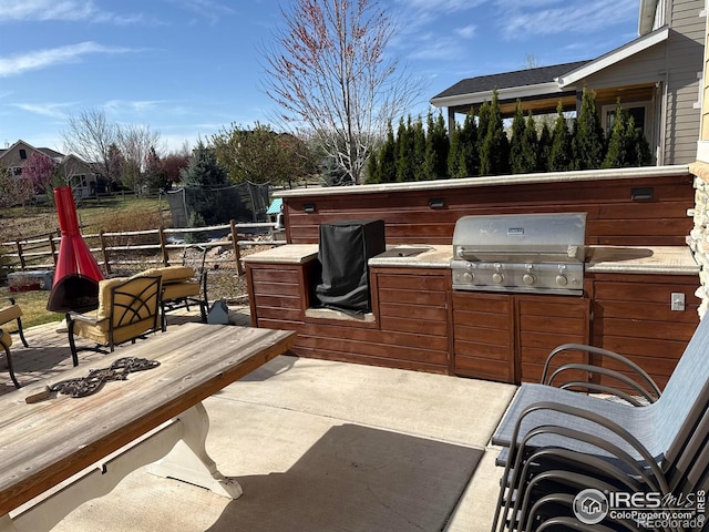 8241 White Owl Ct, Windsor, CO 80550 - view of patio / terrace with area for grilling and a fire pit