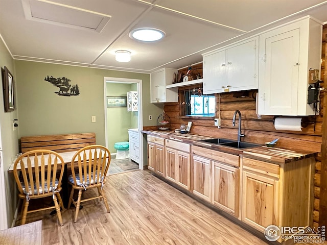 885 County Road 67j, Red Feather Lakes, CO 80545 - kitchen featuring a sink, light wood finished floors, wood counters, open shelves, and ornamental molding