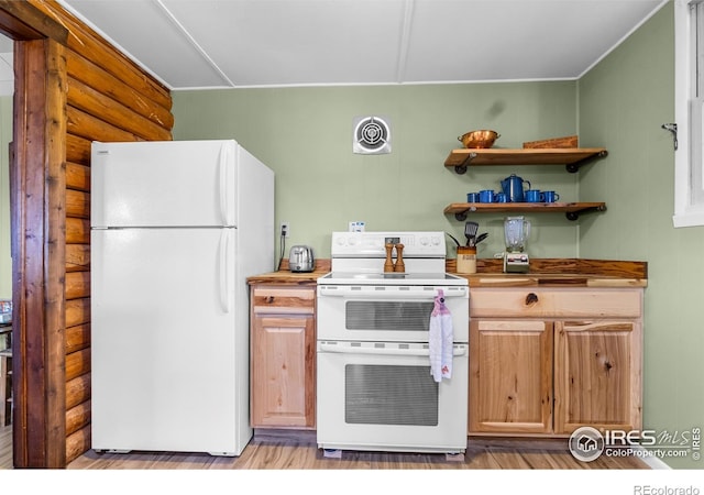 885 County Road 67j, Red Feather Lakes, CO 80545 - kitchen with white appliances, log walls, and light wood-style flooring
