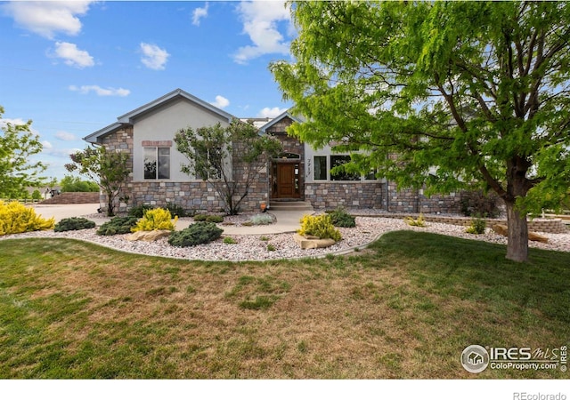 7717 Amour Hill Dr, Greeley, CO 80634 - view of front of property with stone siding, a front lawn, and stucco siding