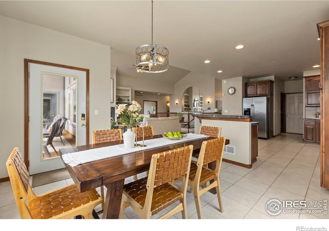 7717 Amour Hill Dr, Greeley, CO 80634 - dining room with a chandelier, light tile patterned flooring, and recessed lighting