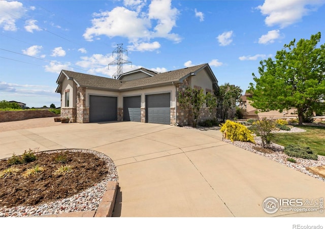 7717 Amour Hill Dr, Greeley, CO 80634 - view of front of house with a garage, concrete driveway, stucco siding, and stone siding