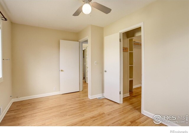 503 E Oak St, Lafayette, CO 80026 - unfurnished bedroom with light wood-style flooring, baseboards, and a ceiling fan