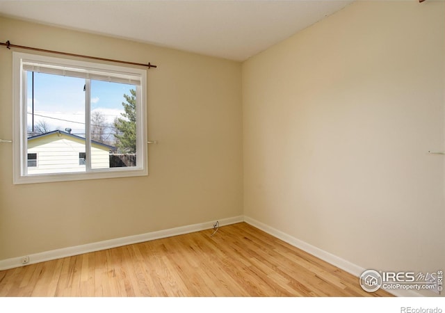 503 E Oak St, Lafayette, CO 80026 - unfurnished room featuring wood finished floors, healthy amount of natural light, and baseboards