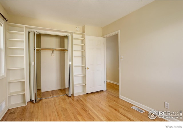 503 E Oak St, Lafayette, CO 80026 - unfurnished bedroom featuring light wood-type flooring, baseboards, and a closet