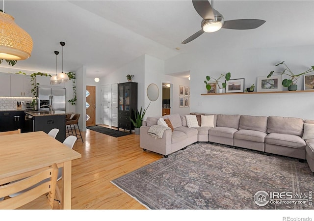 512 Prairie Clover Way, Severance, CO 80550 - living area with light wood-style floors, ceiling fan, and vaulted ceiling