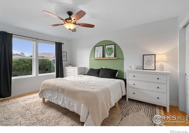 512 Prairie Clover Way, Severance, CO 80550 - bedroom with light wood-style flooring, ceiling fan, and baseboards