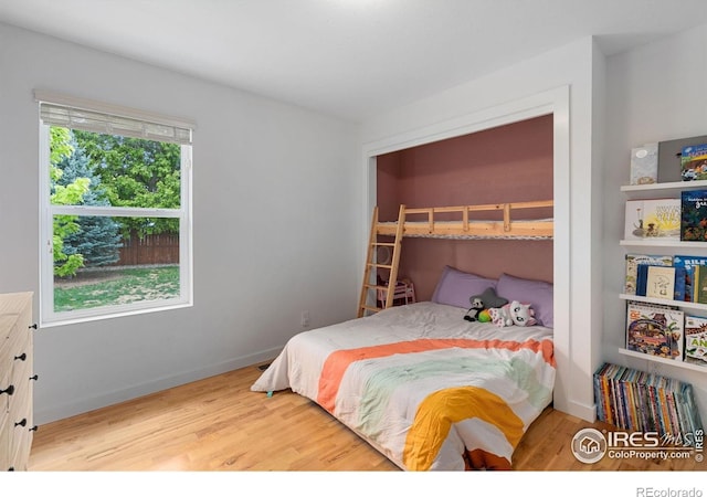 512 Prairie Clover Way, Severance, CO 80550 - bedroom with wood finished floors and baseboards