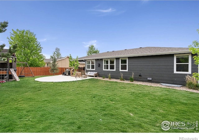 512 Prairie Clover Way, Severance, CO 80550 - rear view of house featuring a patio and a playground