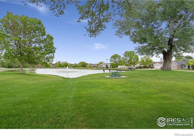 512 Prairie Clover Way, Severance, CO 80550 - view of green lawn with a water view