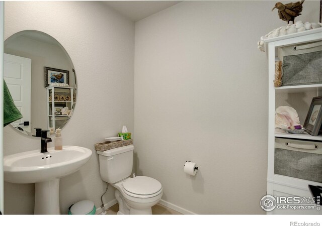 5282 Ribault St, Timnath, CO 80547 - bathroom featuring toilet and baseboards