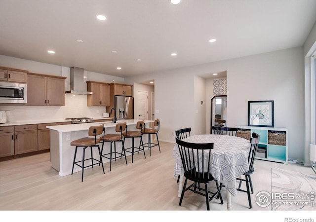 5282 Ribault St, Timnath, CO 80547 - dining room with recessed lighting, light wood finished floors, and baseboards