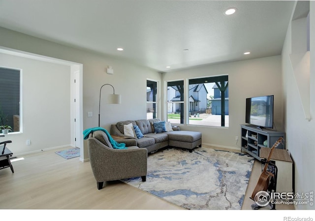 5282 Ribault St, Timnath, CO 80547 - living room with wood finished floors, baseboards, and recessed lighting