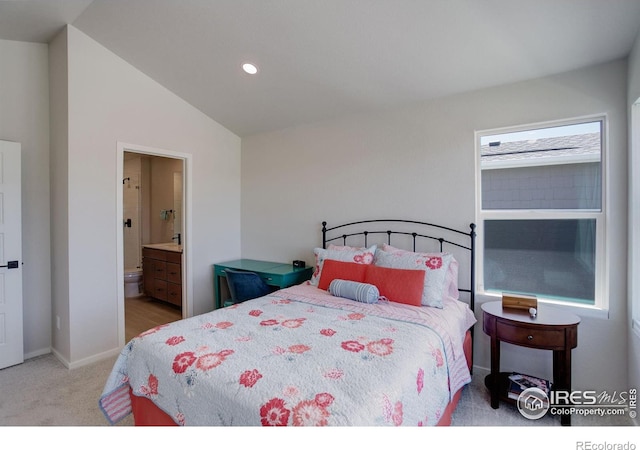5282 Ribault St, Timnath, CO 80547 - carpeted bedroom featuring vaulted ceiling, connected bathroom, and recessed lighting