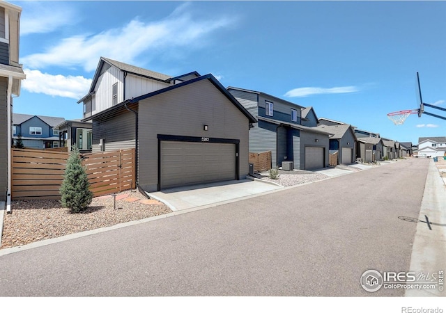 5282 Ribault St, Timnath, CO 80547 - view of front facade with a residential view, fence, a garage, and driveway