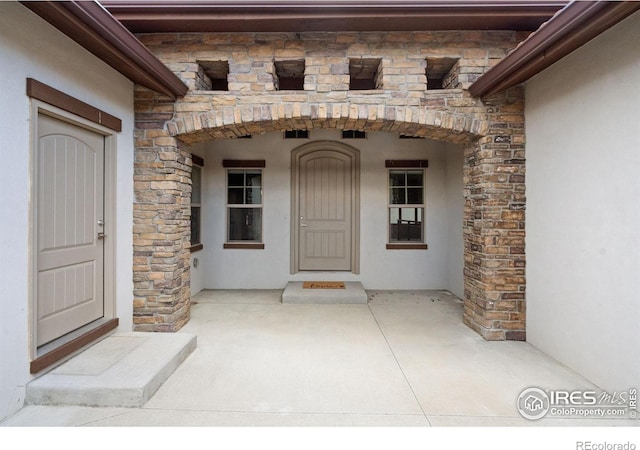 4014 Rock Creek Dr, Fort Collins, CO 80528 - property entrance featuring stone siding and stucco siding