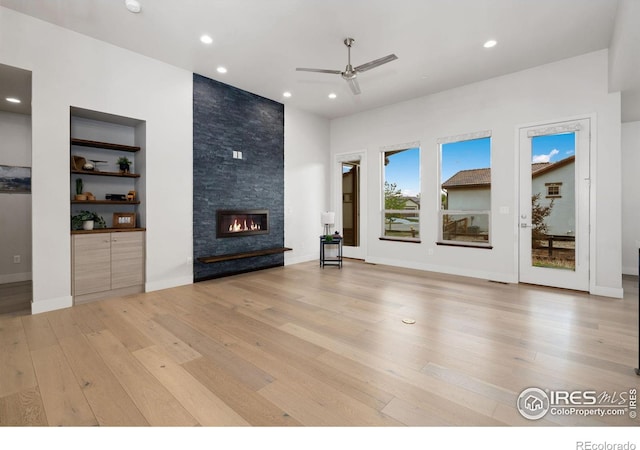 4014 Rock Creek Dr, Fort Collins, CO 80528 - unfurnished living room with a fireplace, light wood finished floors, ceiling fan, recessed lighting, and baseboards