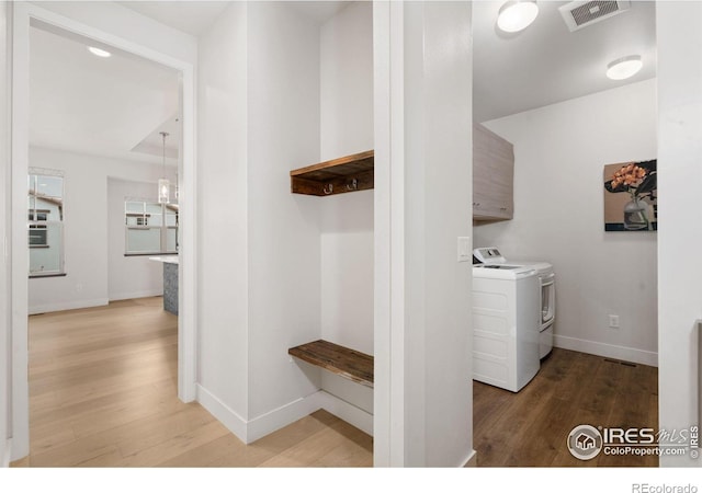 4014 Rock Creek Dr, Fort Collins, CO 80528 - laundry room with wood finished floors, baseboards, and washing machine and clothes dryer