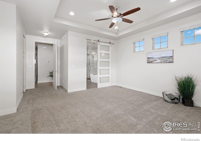 4014 Rock Creek Dr, Fort Collins, CO 80528 - unfurnished bedroom featuring carpet, baseboards, recessed lighting, and a tray ceiling