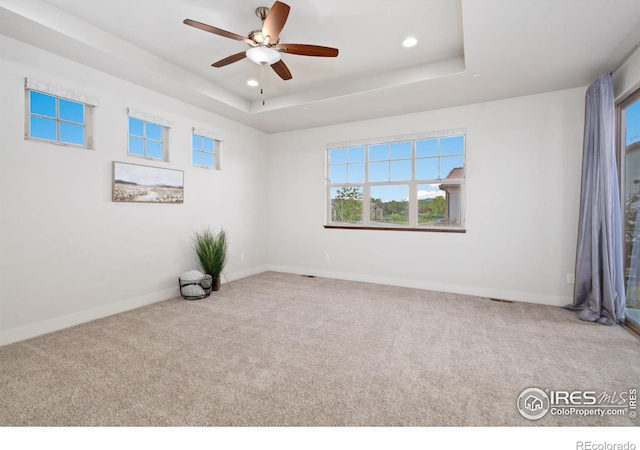 4014 Rock Creek Dr, Fort Collins, CO 80528 - empty room featuring recessed lighting, carpet floors, a raised ceiling, baseboards, and a ceiling fan