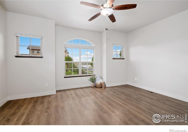 4014 Rock Creek Dr, Fort Collins, CO 80528 - empty room with wood finished floors, baseboards, and ceiling fan