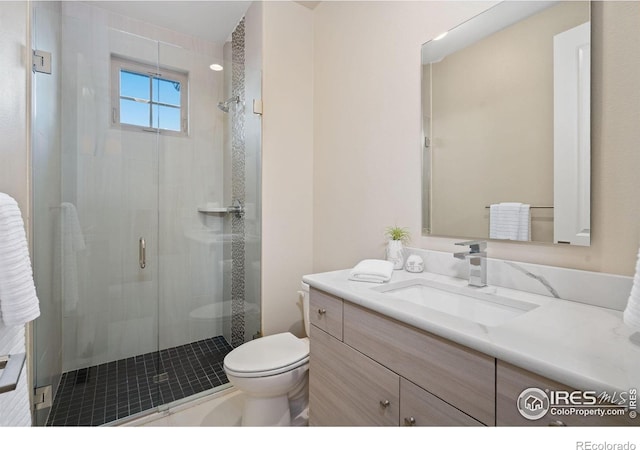 4014 Rock Creek Dr, Fort Collins, CO 80528 - bathroom featuring toilet, a shower stall, and vanity