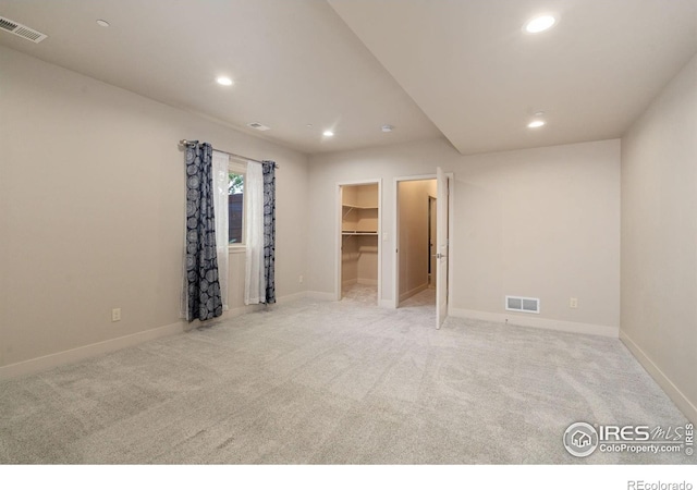 4014 Rock Creek Dr, Fort Collins, CO 80528 - unfurnished bedroom with recessed lighting, light carpet, a spacious closet, and baseboards