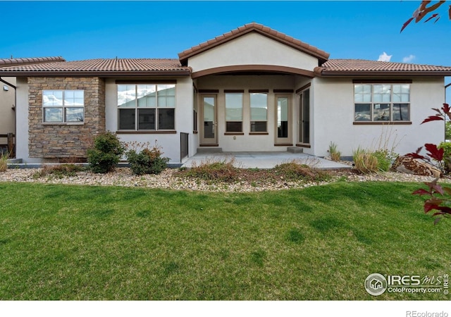 4014 Rock Creek Dr, Fort Collins, CO 80528 - view of front of property with stucco siding, a front yard, and a tiled roof