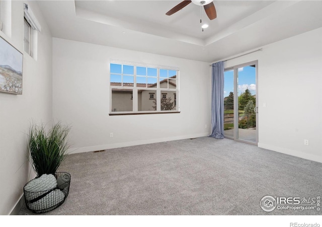 4014 Rock Creek Dr, Fort Collins, CO 80528 - spare room with a tray ceiling, a ceiling fan, carpet flooring, baseboards, and recessed lighting
