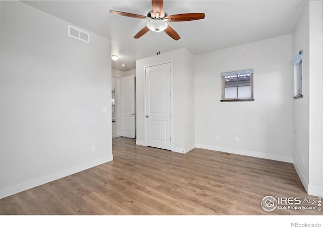 4014 Rock Creek Dr, Fort Collins, CO 80528 - spare room with ceiling fan, baseboards, and light wood-style flooring