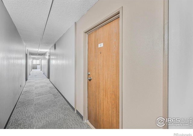 4110 Hale Pkwy # 5F, Denver, CO 80220 - corridor with a textured ceiling and carpet