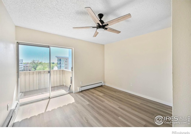 4110 Hale Pkwy # 5F, Denver, CO 80220 - empty room featuring a baseboard radiator, baseboard heating, wood finished floors, a ceiling fan, and a textured ceiling