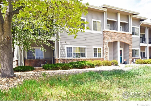 5014 Northern Lights Dr, Fort Collins, CO 80528 - view of front of home featuring stone siding