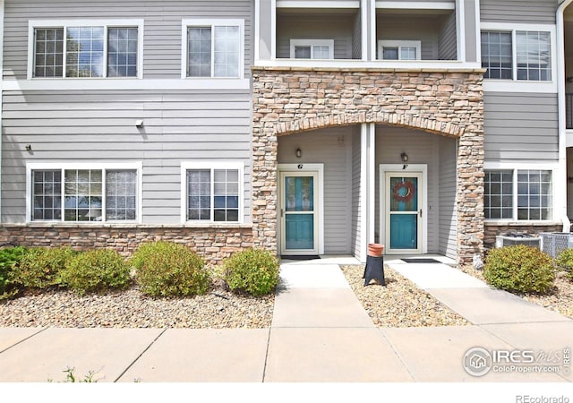 5014 Northern Lights Dr, Fort Collins, CO 80528 - doorway to property with stone siding