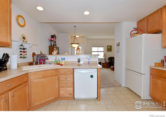 5014 Northern Lights Dr, Fort Collins, CO 80528 - kitchen featuring white appliances, a peninsula, a sink, light countertops, and light flooring