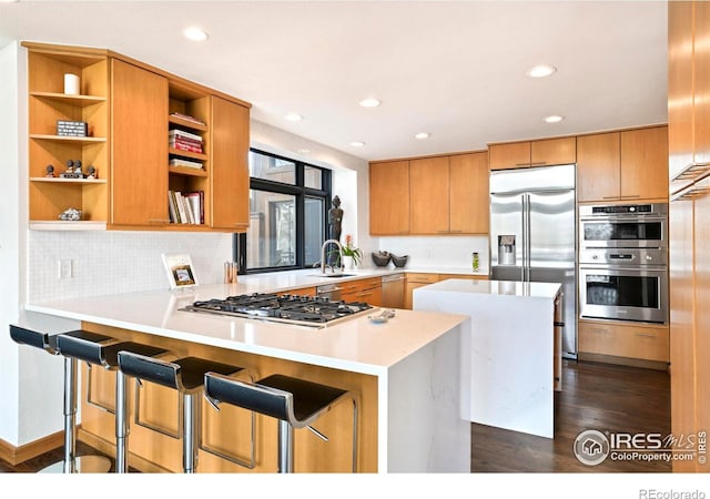 3746 Wonderland Hill Ave, Boulder, CO 80304 - kitchen featuring appliances with stainless steel finishes, open shelves, a peninsula, light countertops, and decorative backsplash