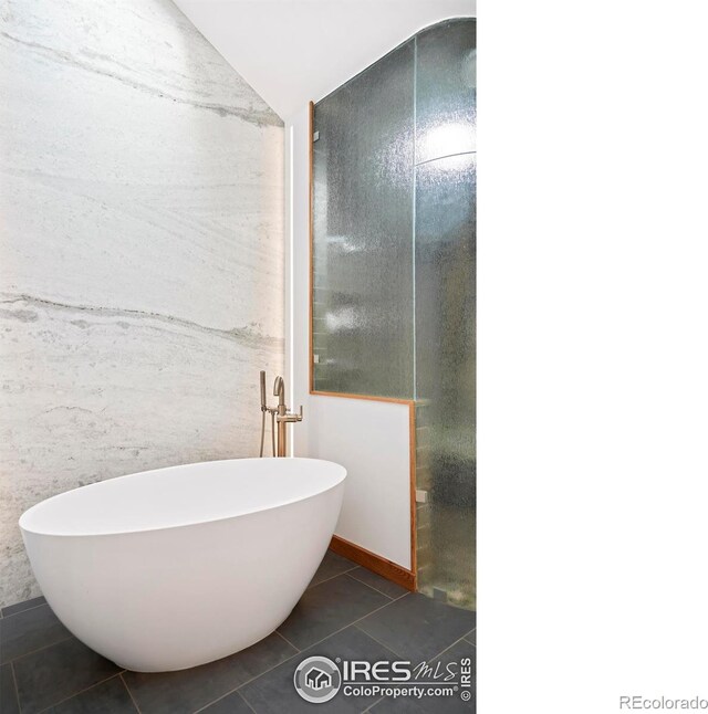 3746 Wonderland Hill Ave, Boulder, CO 80304 - bathroom featuring tile patterned floors and a freestanding bath