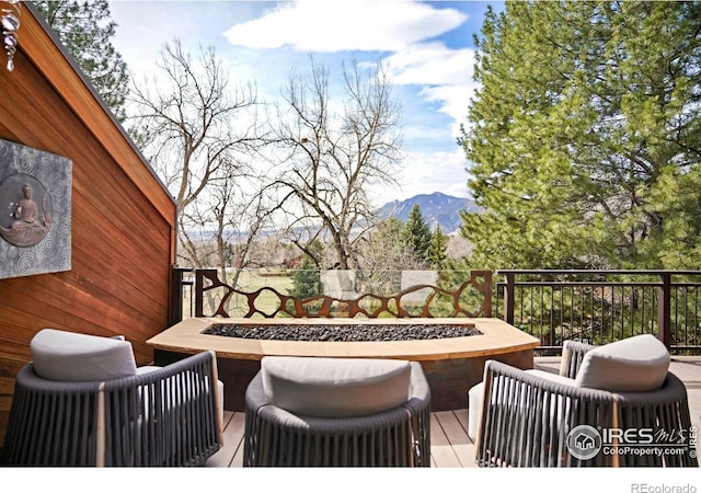 3746 Wonderland Hill Ave, Boulder, CO 80304 - wooden terrace featuring an outdoor fire pit and a mountain view
