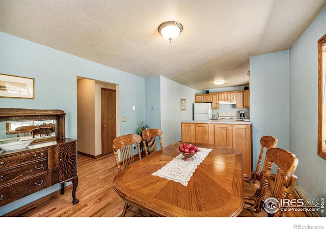 60 Horn Peak Dr, Livermore, CO 80536 - dining space with light wood finished floors and a textured ceiling