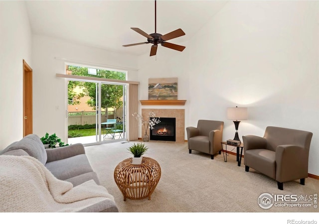 4603 Dusty Sage Ct Unit 4, Fort Collins, CO 80526 - living room with carpet floors, a tile fireplace, a ceiling fan, and a towering ceiling