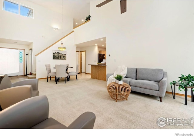 4603 Dusty Sage Ct Unit 4, Fort Collins, CO 80526 - living room with light carpet, a high ceiling, a ceiling fan, baseboards, and recessed lighting
