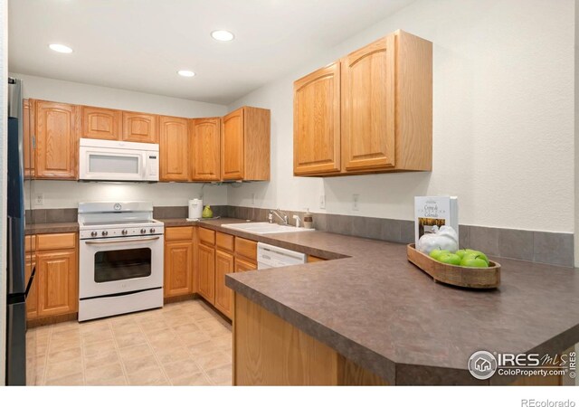 4603 Dusty Sage Ct Unit 4, Fort Collins, CO 80526 - kitchen with white appliances, a sink, recessed lighting, and dark countertops